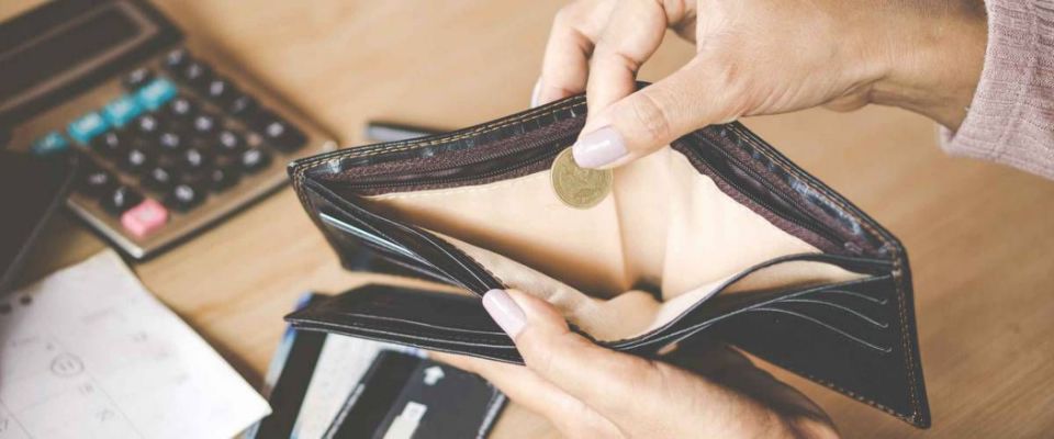 poor Asian woman hand open empty purse with only one coin left bankrupt broke after credit card payday