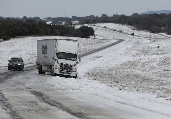 A tractor trailer is stuck in the ice and snow in Killeen, Texas. The winter storms that wreaked havoc across the South and Midwest have affected futures for oil and natural gas prices.