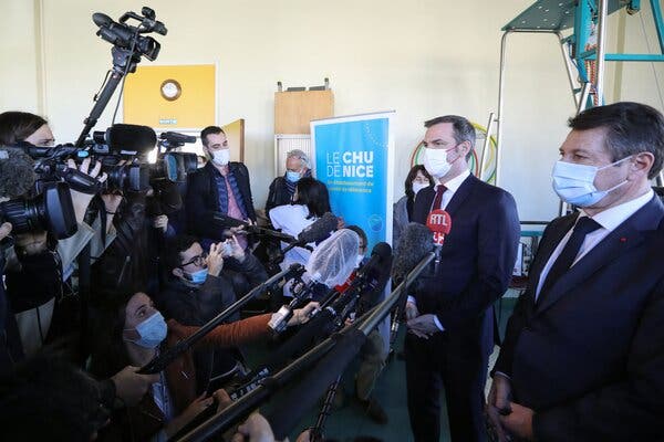 Olivier Véran, the French health minister, second from right, in Nice on Saturday. He said the consulting giant McKinsey & Company had helped with the vaccine rollout but played no role in policy decisions.