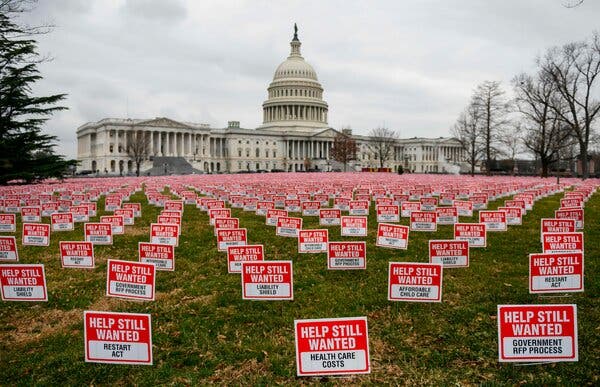 Signs set up in Washington last month called for more support for small businesses.