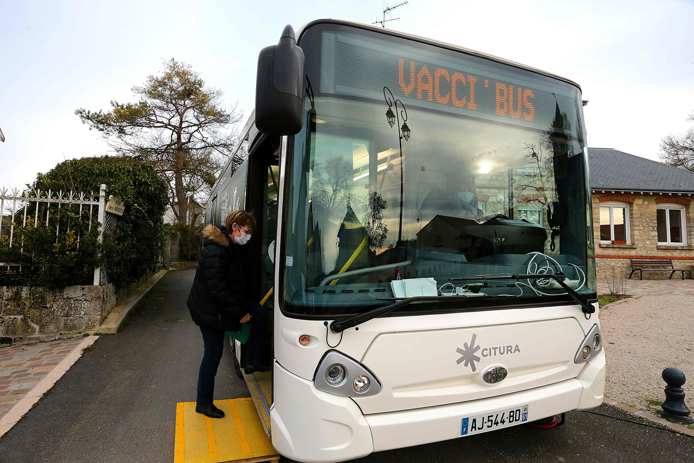 A woman gets in the VACCI'BUS, which goes village to village to enable people with reduced mobility to be easily vaccinated, in Bouleuse, France, on Jan. 20, 2021.