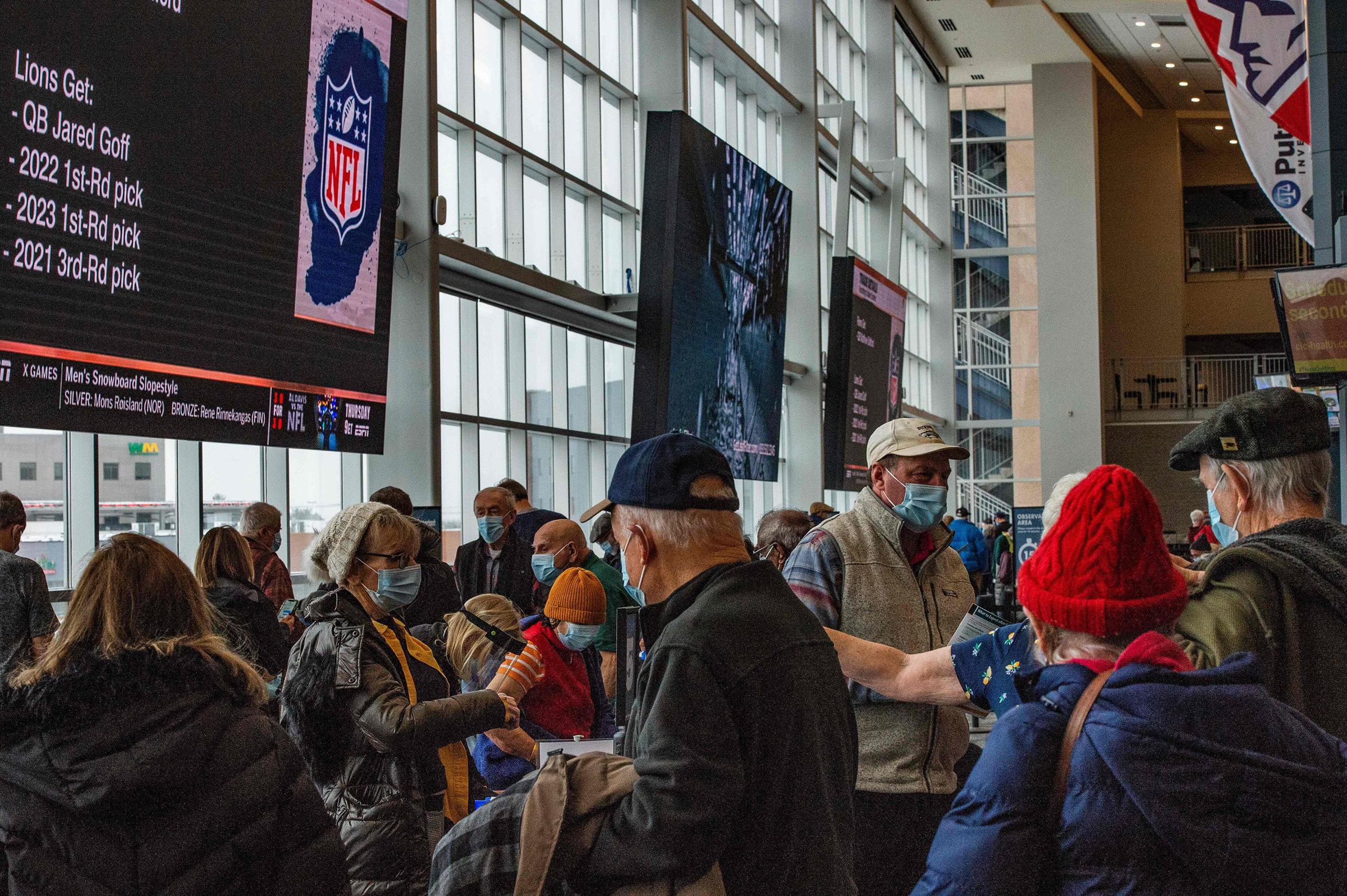 Hundreds of people move through Gillette Stadium in Foxborough, Mass., as they receive their COVID-19 vaccine on Feb. 1, 2021.