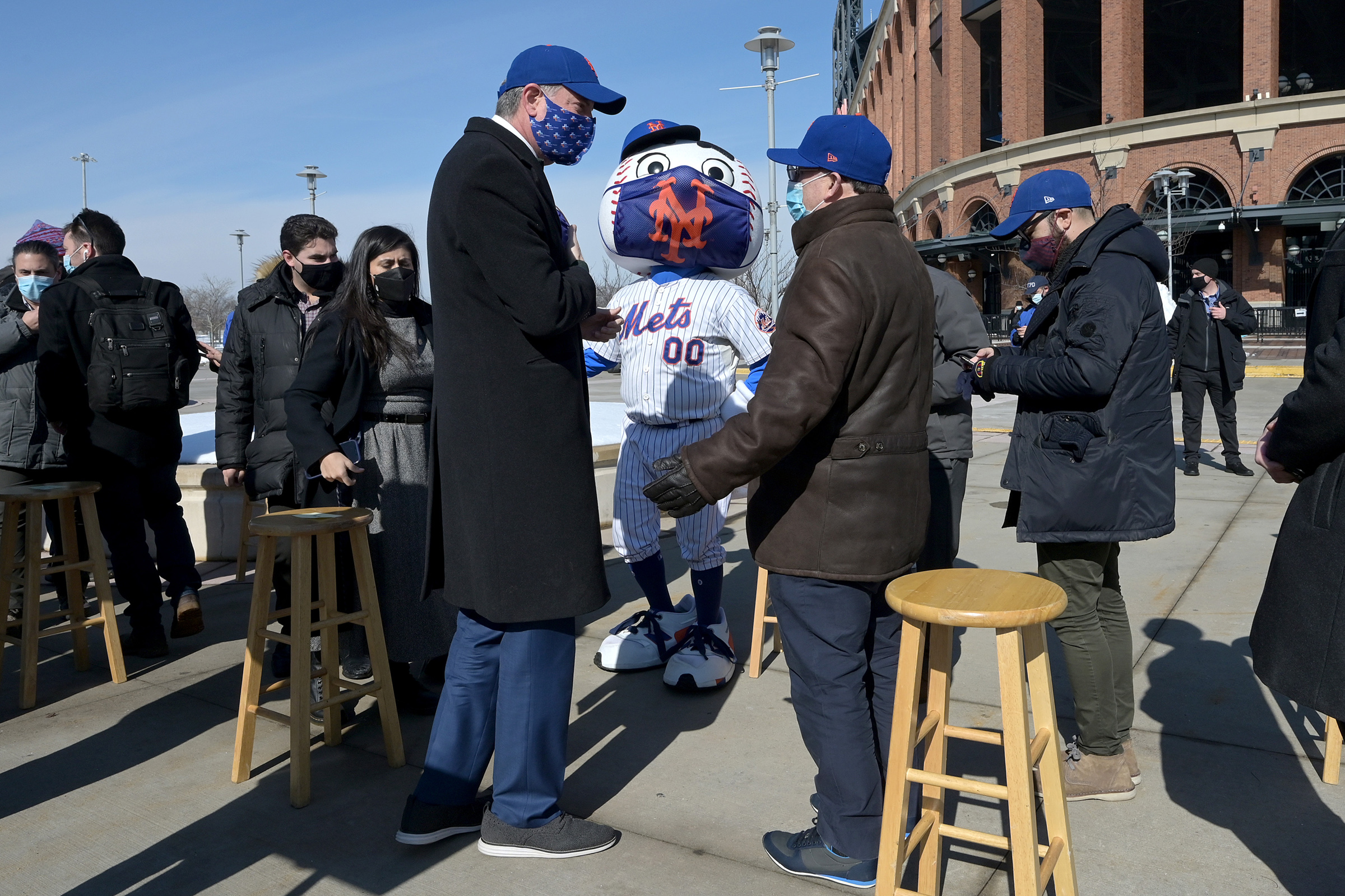 New York City Mayor Bill de Blasio, left, and New York Mets baseball team owner Steve Cohen speak after a press conference to announce the opening of Mets Citi Field stadium as a COVID-19 Vaccine Mega Hub in Queens, N.Y., on Feb. 10, 2021.