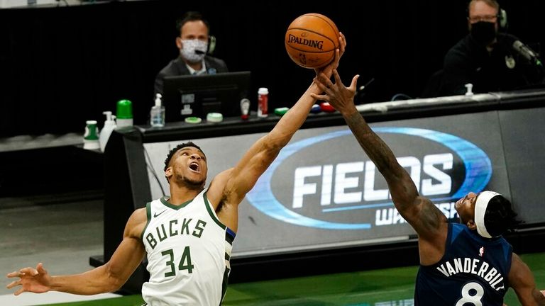 AP - Milwaukee Bucks&#39; Giannis Antetokounmpo and Minnesota Timberwolves&#39; Jarred Vanderbilt go after a rebound