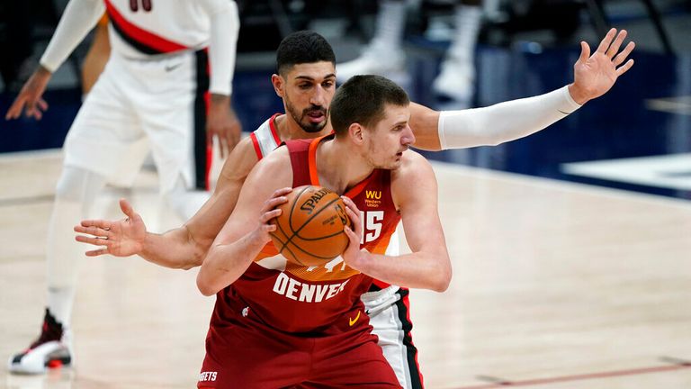 AP - Denver Nuggets center Nikola Jokic looks to pass the ball as Portland Trail Blazers center Enes Kanter 