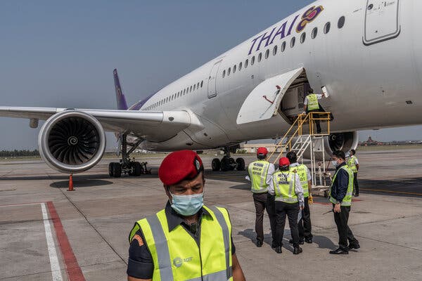 Preparing to offload a refrigerated container carrying Thailand’s first delivery of Covid-19 vaccines at Suvarnabhumi Airport in Bangkok on Wednesday.