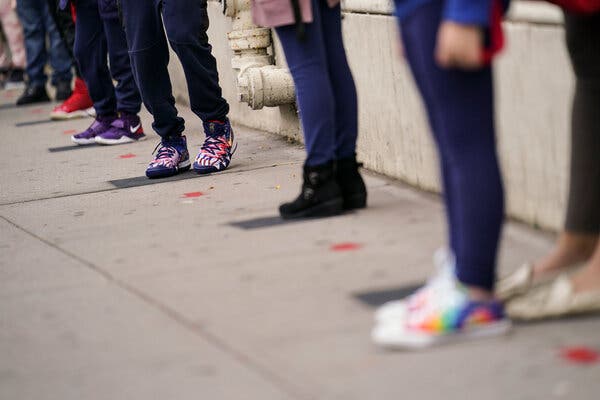 Students wait at distanced intervals as they arrive for school in New York in September. For teenagers in a mental health crisis, there aren’t many places to turn.