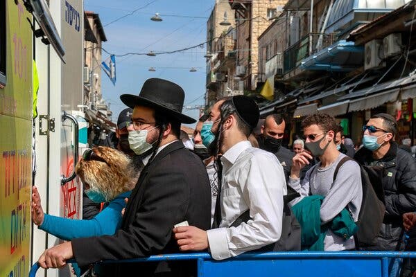 Awaiting vaccinations at a mobile clinic in Jerusalem on Monday.