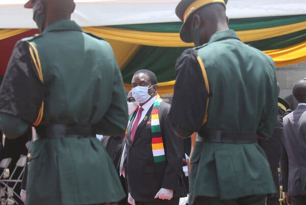 “The time shall come when those who are not vaccinated won’t get jobs,” said President Emmerson Mnangagwa of Zimbabwe, center.