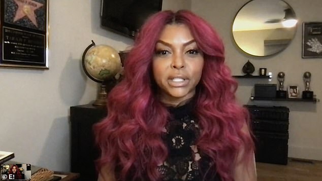 Her hair was fire: Taraji had on a black lace dress as she modeled bright magenta locks