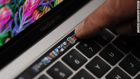 An Apple employee demonstrates the Touch Bar on a new MacBook Pro during a 2016 product launch event in Cupertino, California.