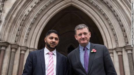 Uber drivers Yaseen Aslam, left, and James Farrar, pose outside the Court of Appeal in London in 2018.