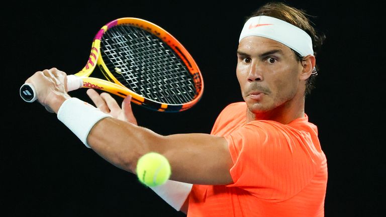 Rafael Nadal makes a backhand return to Michael Mmoh during their second-round match at the Australian Open (AP Photo/Rick Rycroft)