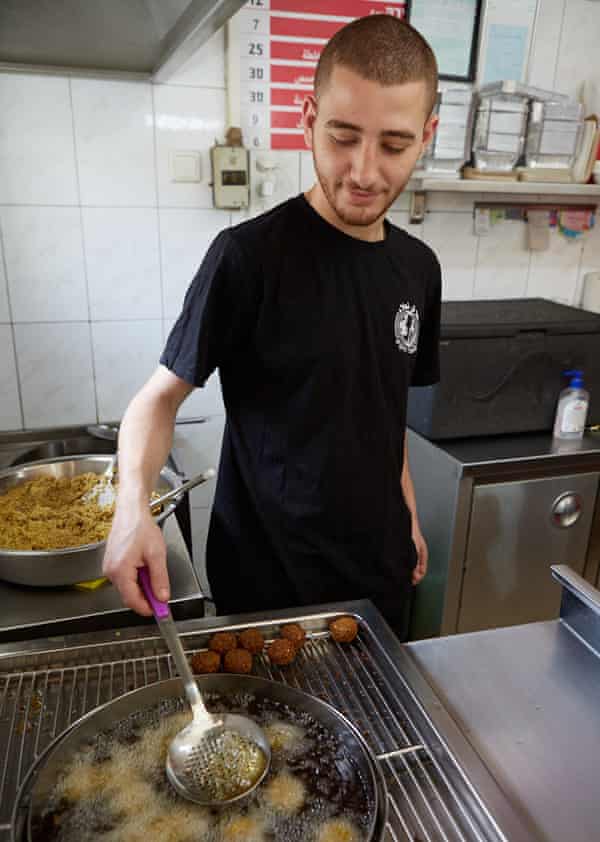 Frying the falafel balls in a Tel Aviv kitchen