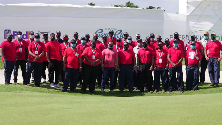 The maintenance crew in Puerto Rico all in red and black as a tribute to Woods