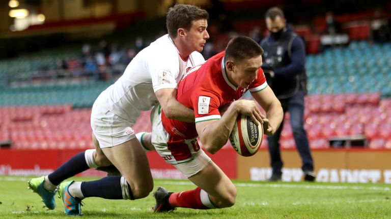 Wales' Josh Adams dives in to score a highly controversial try  