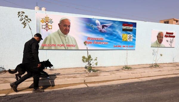 A security officer in Baghdad on Wednesday. The pope’s visit flies in the face of nearly all public health guidelines.