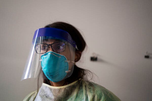 Dr. Eva Galvez prepares to test patients for Covid-19 at a clinic in Hillsboro, Ore.