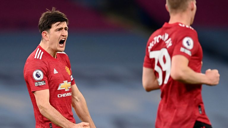 Harry Maguire roars with delight at the final whistle at the Etihad