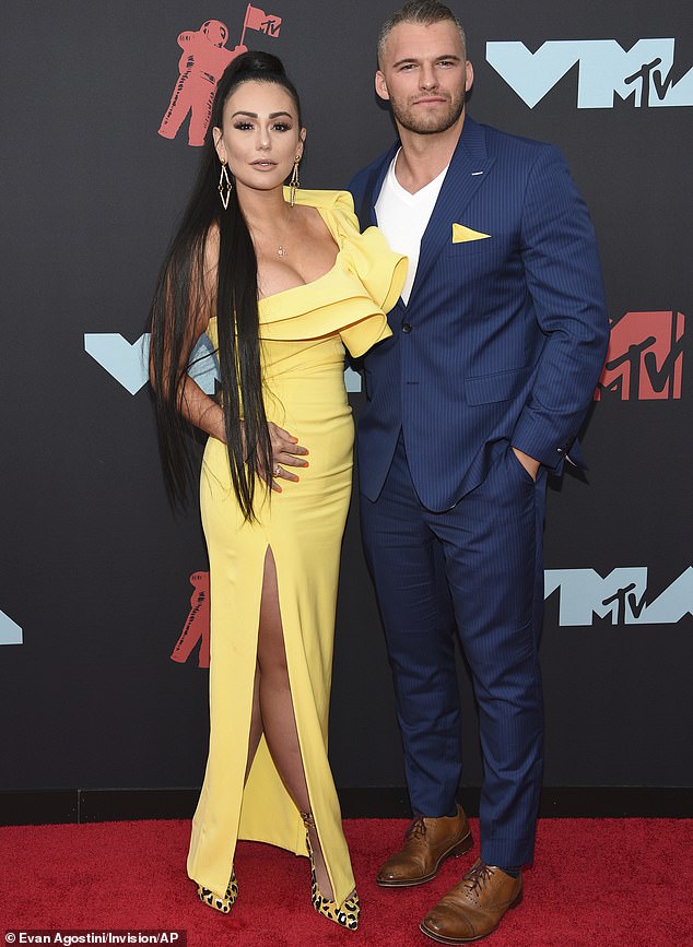 Hot couple: JWoww has gushed on Jersey Shore that Zack was 'a f***ing monster in bed' to the point she once said to him: 'Are you an escort? What's going on?'; pictured in August 2019