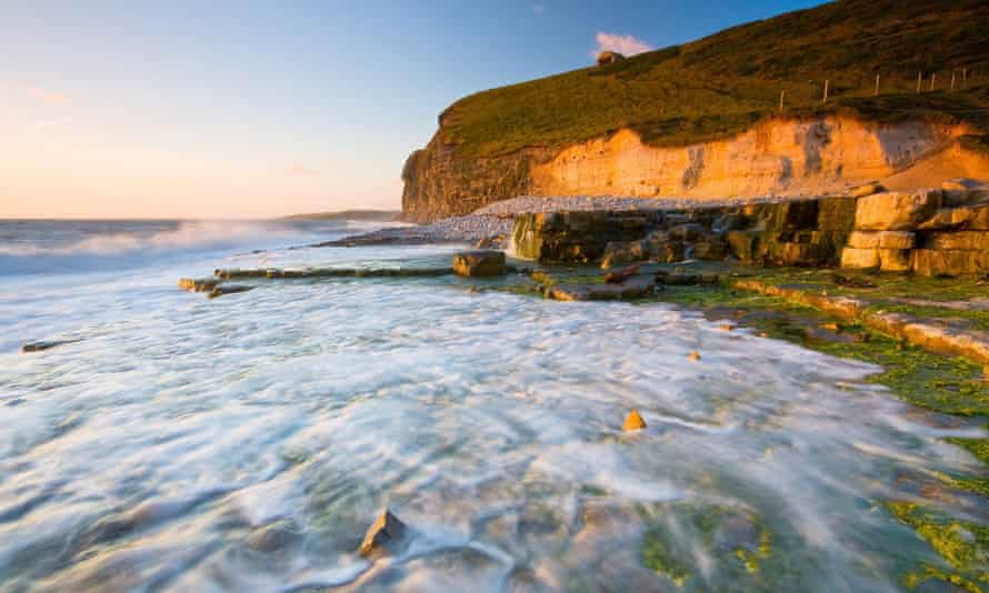 Monknash beach in Glamorgan, Wales, UK cliffs, rocks, tide in