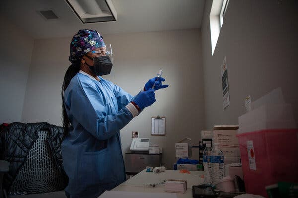 Tara Gallion prepared a dose of the Moderna vaccine at the Delta Health Center in Mound Bayou, Miss., in January.