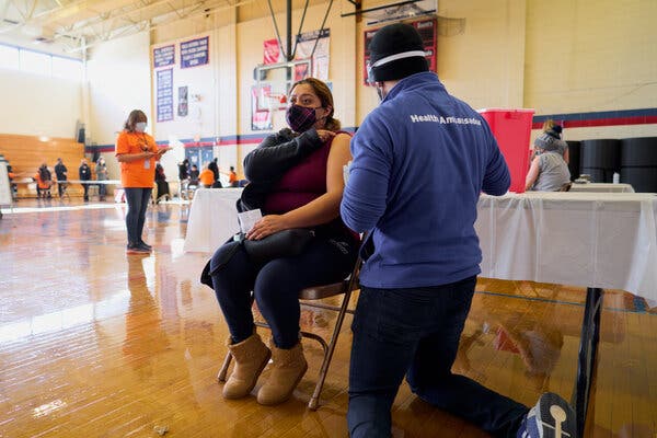 Anallely Falcon receiving her second dose on in Central Falls, R.I., last month.