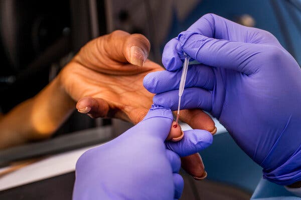 A rapid coronavirus antibody test sample is taken from a patient at Southside Church of Christ in Los Angeles earlier this year.