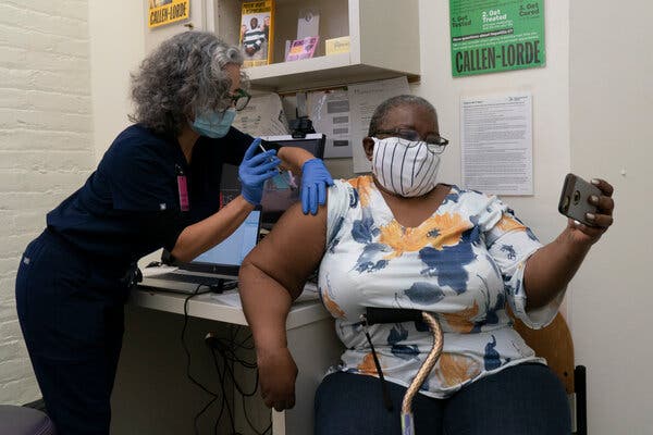 Denise Saylor photographed herself as Lara Comstack injected her with  vaccine in January at the Callen-Lorde Community Health Center in Manhattan.