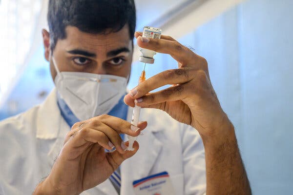 Ambar Keluskar preparing a Moderna Covid-19 vaccine in Brooklyn on Saturday.