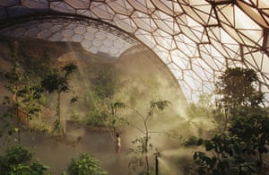 The woman watering the plants is dwarfed by the enormity of the world’s largest greenhouse, Eden Project. (