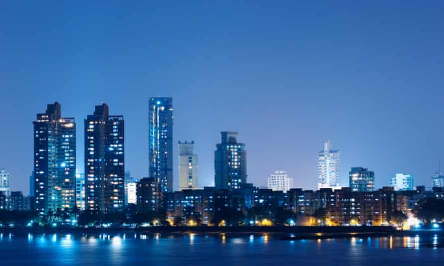 Mumbai’s buildings lit up at dusk.