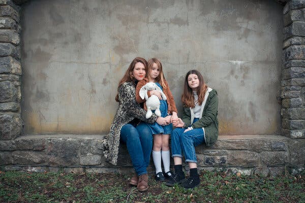 Jessie Astbury Allen with her daughters Mae, 7, and Livia, 12. They left China more than a year ago; Ms. Astbury Allen&rsquo;s husband is still there.