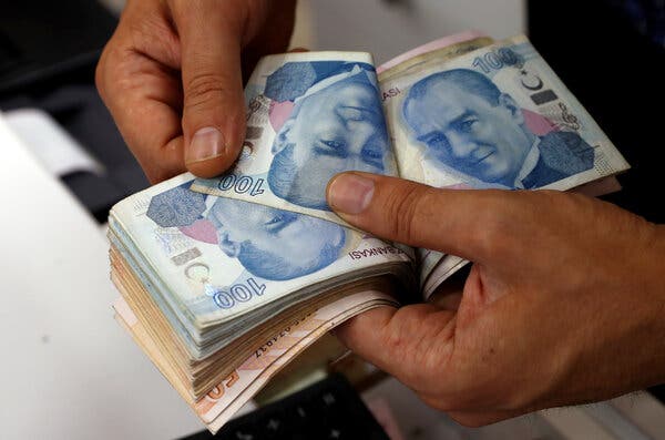 Turkish lira banknotes at a currency exchange in Ankara. An unexpected change at the head of Turkey’s central bank caused a steep drop in the lira’s value.