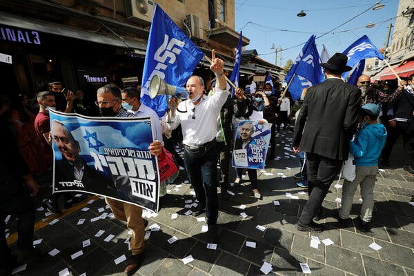 Likud supporters campaigned for Prime Minister Benjamin Netanyahu in Jerusalem last week. Mr. Netanyahu will remain caretaker prime minister during negotiations.