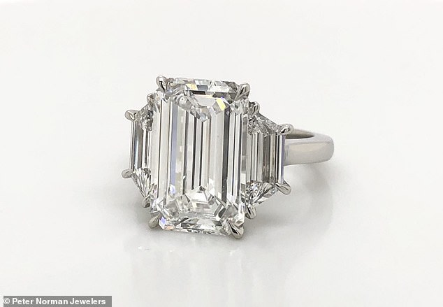 So similar: This matching ring is from Peter Norman Jewelers. Three stone engagement ring featuring a large emerald-cut diamond and trapezoid side stones