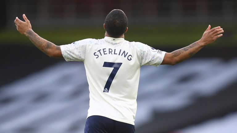 Raheem Sterling celebrates after putting Man City in front against Arsenal (AP)