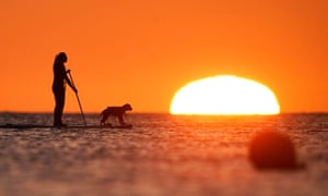 paddleboarding at sunrise in Cullercoats Bay, North Tyneside