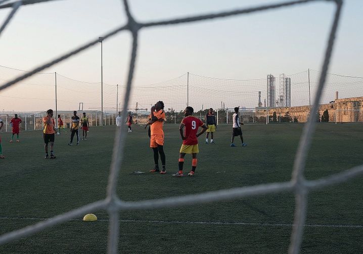 Abdalla and Lamin playing soccer