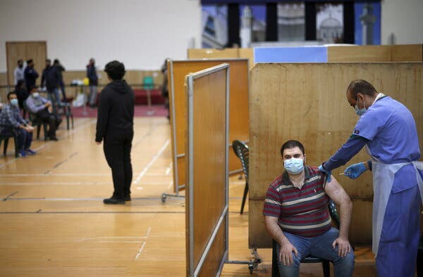 A vaccination centre at a mosque in London, on Sunday. Britain has given over 30 million vaccine doses.