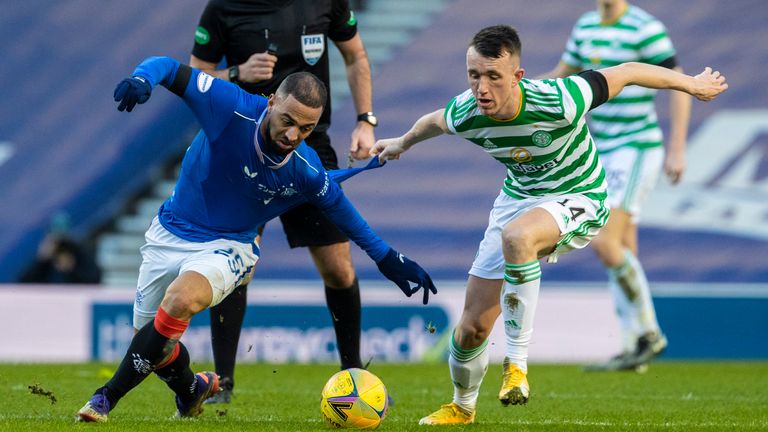 Rangers&#39; Kemar Roofe (left) tussles with Celtic&#39;s David Turnbull 