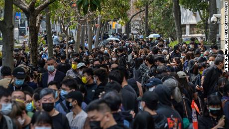 Supporters wait outside West Kowloon court in Hong Kong on March 1, 2021.