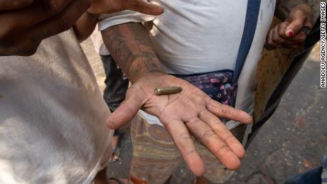 A demonstrator shows a bullet cartridges to the camera during a protest against the military coup in Mandalay, Myanmar on March 3, 2021. 