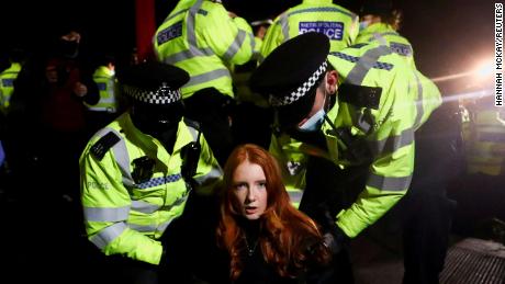 Police detain Patsy Stevenson on March 13 as people gathered at a peaceful memorial in London following the murder of Sarah Everard. Those scenes led to criticism of the police and increased scrutiny of the pending crime bill.