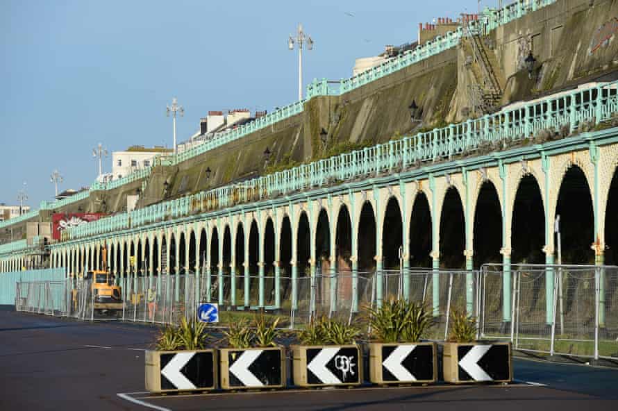 The dilapidated Madeira Terrace on Brighton seafront lies fenced off