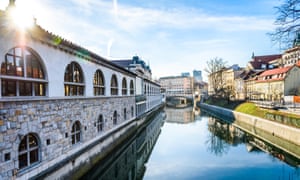 View of Ljubljanica River with old central market and Triple bridge, Ljubljana.