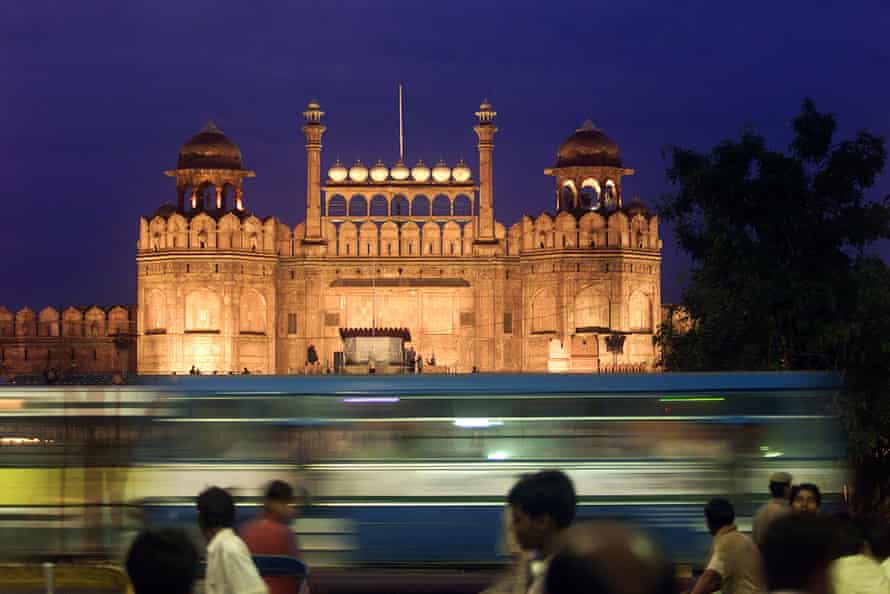 Traffic goes past the Red Fort in Delhi.