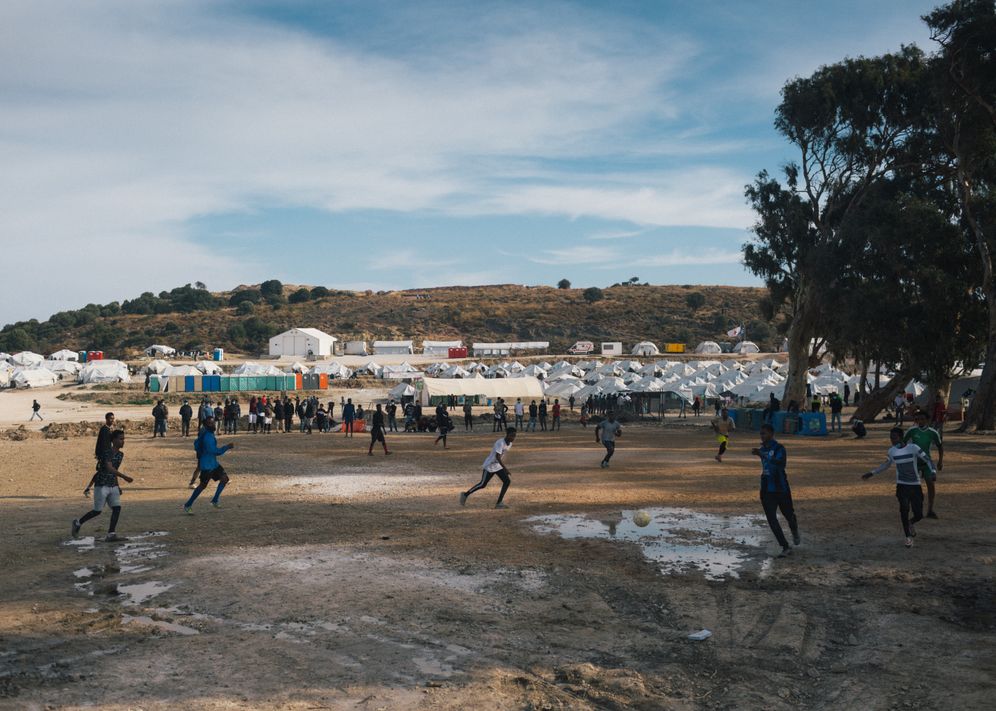 Teenagers playing soccer at the new camp