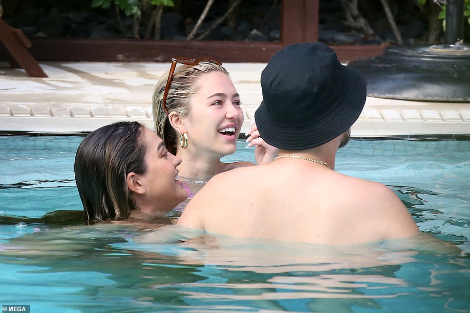 Trio: Scott, Amelia, and Delilah all kicked back together in the pool to take some time off from their schedules, which will often see them spend time at the beach and at luxury hotels