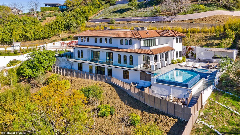 Stunning: The sprawling Sherman Oaks property features expansive 180-degree canyon views which can be seen from the large infinity pool and hot tub